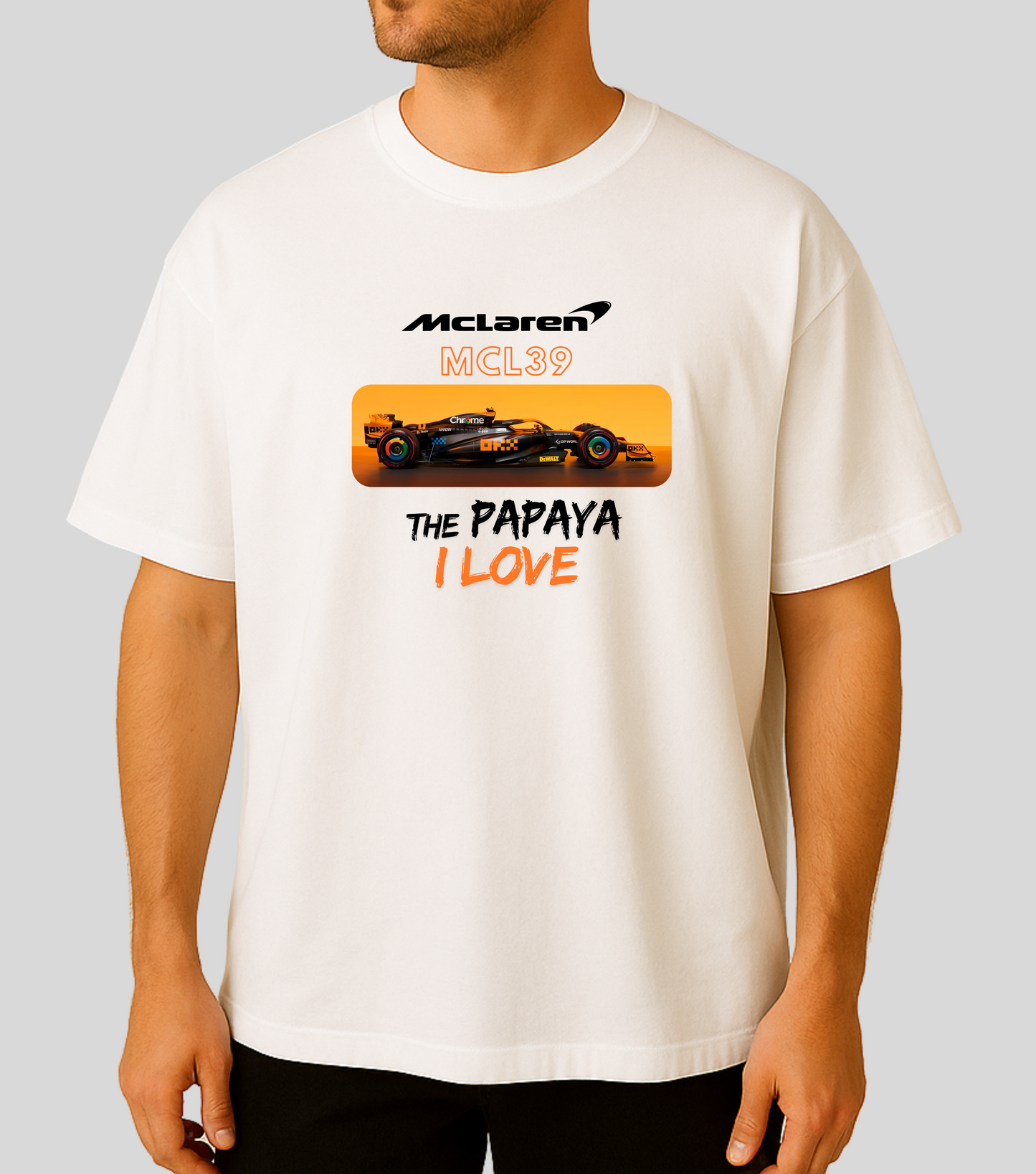 Person wearing a white t-shirt with McLaren logo and car graphic.