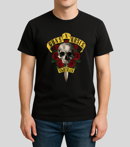 A man wearing a black short-sleeve t-shirt with a Guns N' Roses 'Nightfall' graphic on the front, paired with blue jeans, against a solid gray background.